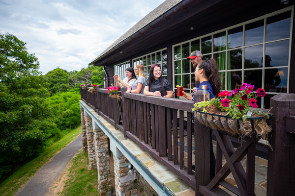 A group of guests on the terrace at Big Meadows Lodge